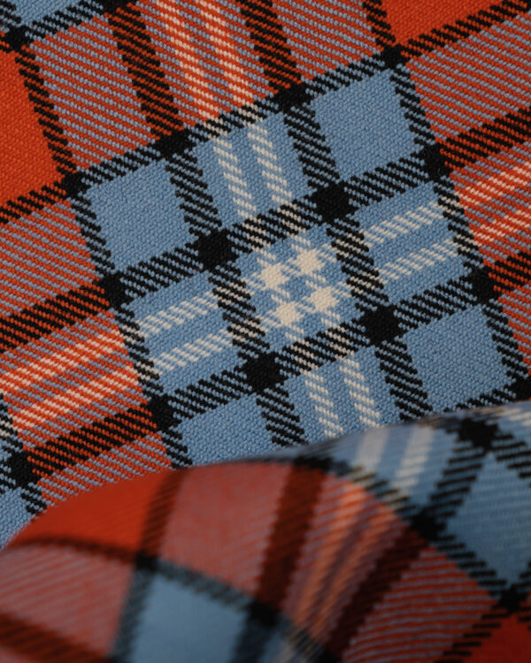 Spirit of Le Mans (SOLM) "Racing" tartan fabric in blue & orange is one of the most famous motorsport livery colors in history.