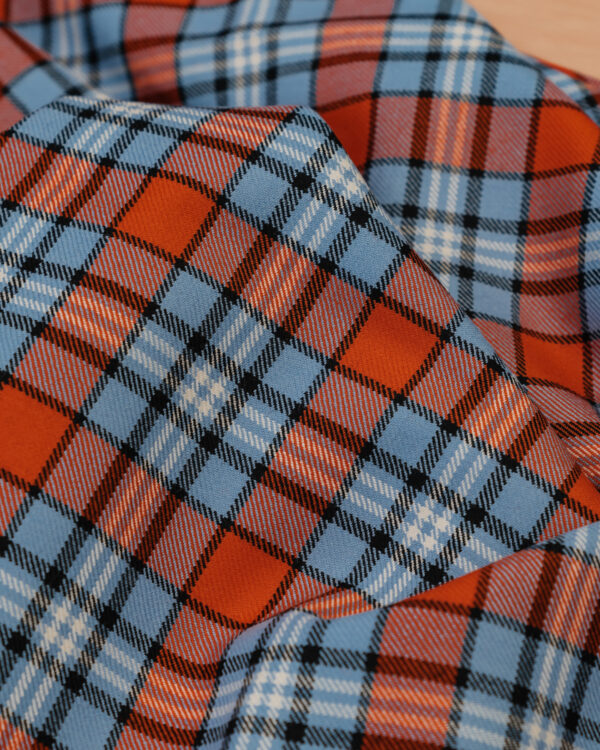 Spirit of Le Mans (SOLM) "Racing" tartan fabric in blue & orange is one of the most famous motorsport livery colors in history.