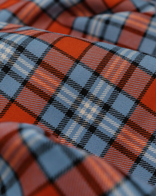 Spirit of Le Mans (SOLM) "Racing" tartan fabric in blue & orange is one of the most famous motorsport livery colors in history.