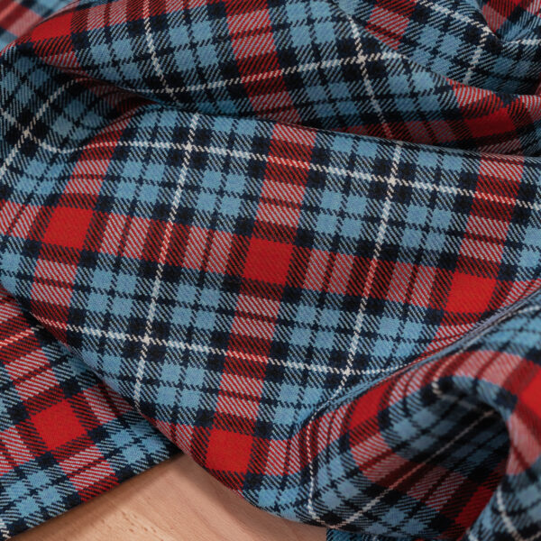Spirit of Le Mans (SOLM) "Retro Racing" tartan fabric was inspired by the Martini Racing livery.