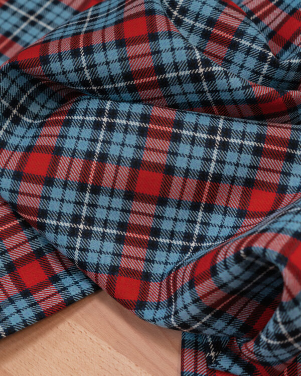 Spirit of Le Mans (SOLM) "Retro Racing" tartan fabric was inspired by the Martini Racing livery.
