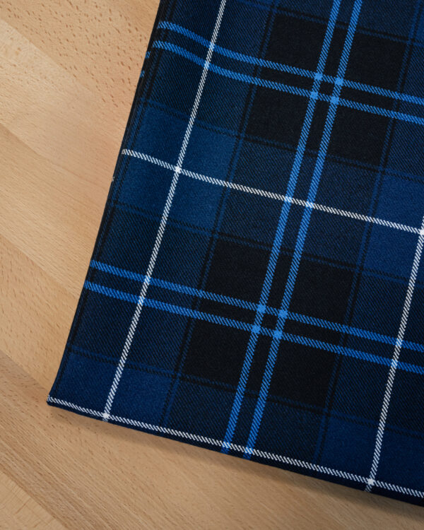 Tartan dark blue with blue & white stripes.