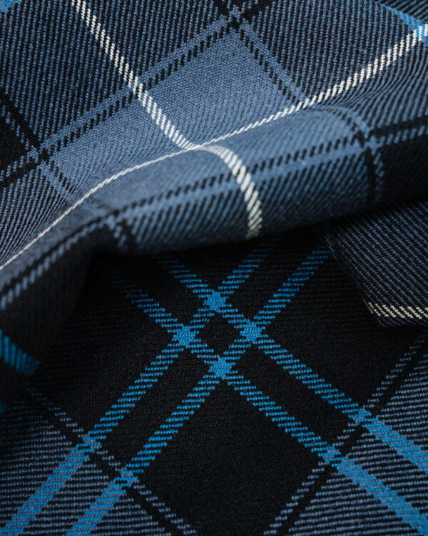 Tartan grey and blue with lighter blue stripe.