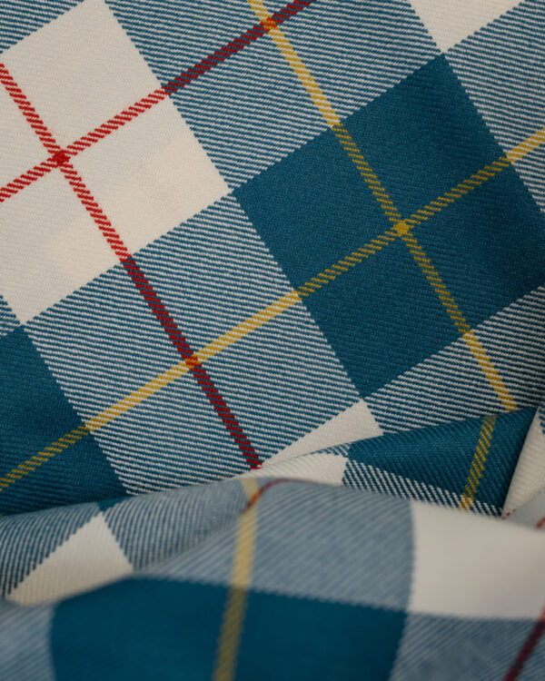 Tartan blue& white with red & yellow stripes.