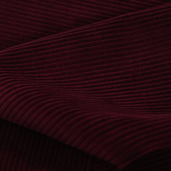 Kordsamt / Corduroy / Cord / Cord velvet coarse fabric in red.