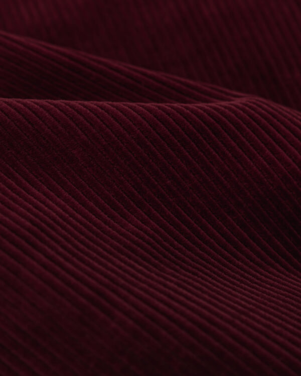 Kordsamt / Corduroy / Cord / Cord velvet coarse fabric in red.
