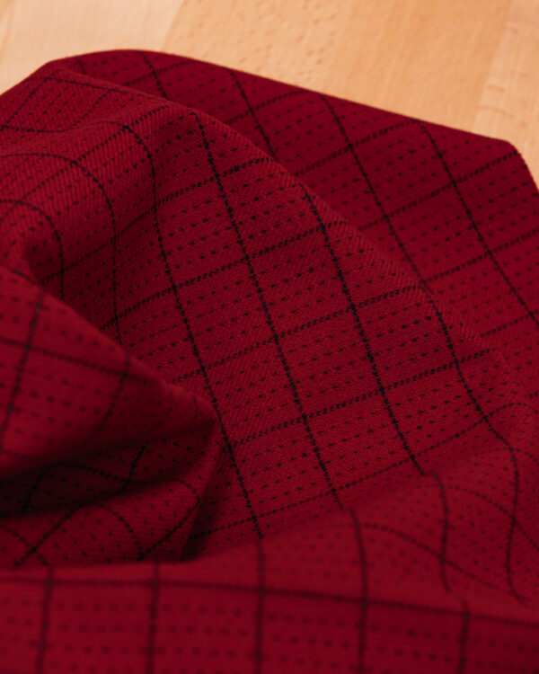 Red with black square stripes fabric.