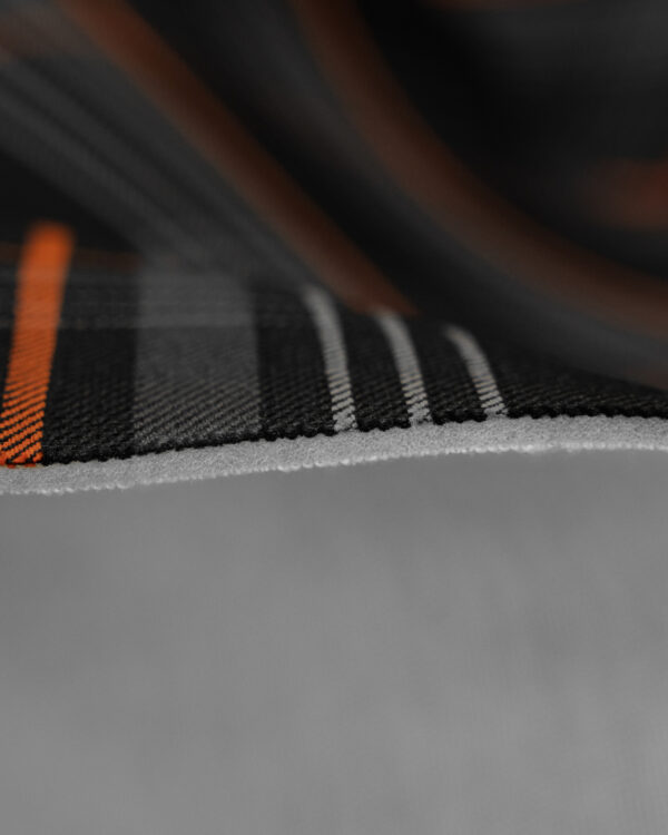 Tartan black & gray fabric with orange stripes. Originally used in the Volkswagen Golf MK7 models like GTI, GTE and GTD.